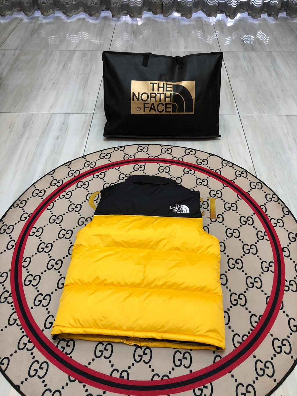 The North Face Yellow and Black Colorblock Puffer Vest