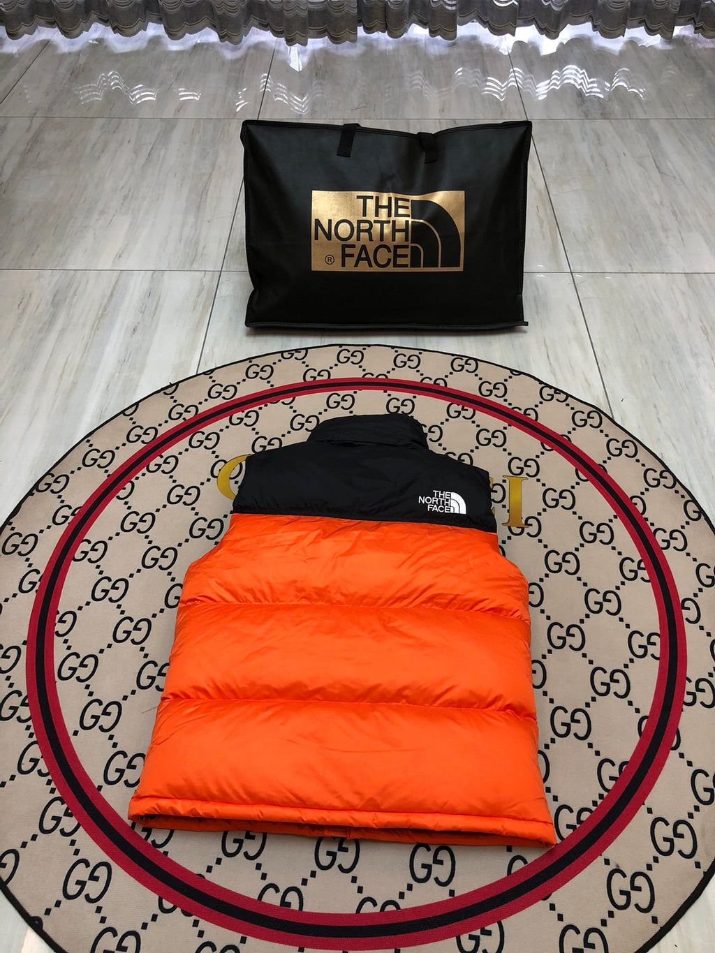 The North Face Orange and Black Colorblock Puffer Vest