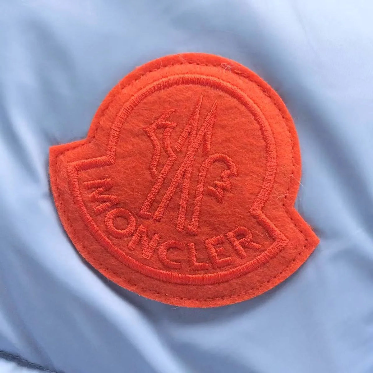 Moncler Ice Blue Hooded Puffer Jacket with Orange Logo